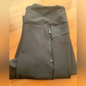 EUC - Athleta leggings, black with two front hip zippers . Size medium.